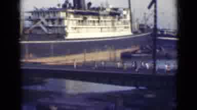 India (1947): Sped Up Clip Of Groups Of People Crossing A Bridge Going To And