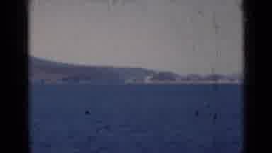India (1947): Coastline Being Filmed From Ocean With Hills In The Distance