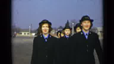 New York (1947): All Females Dressed In Black Military Uniforms Skirts Marching