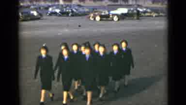 New York (1947): Group Of Women Dressed In Black Military Uniforms Marching In