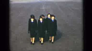 New York (1947): Eleven Woman In Black March In Perfect Syncronia Wearing Heats