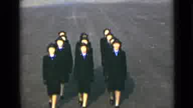 New York (1947): A Parade Of Women Wearing All Black Proceed In A Line Before