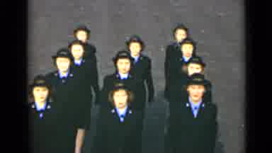 New York (1947): Eleven Women In Formal Uniforms March In Sync On A Blacktop Road