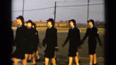 New York (1947): Women In Black Uniforms Marching Back And Forth In A Specific