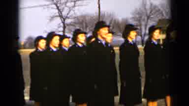 New York (1947): Uniformed Women In Black Dress Marching On The Avenue