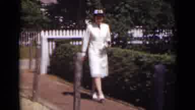 New York (1947): Woman In Uniform And Hat Walks Down A Path Past Some Bushes Cuts