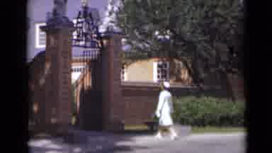New York (1947): Lady In All White Dress Walks To The Gate And Stops