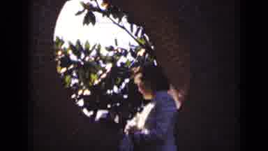 New York (1947): Woman Wearing White Shirt Gazes Through Circular Window On A