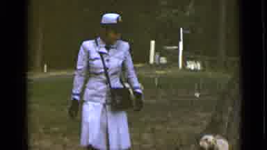 New York (1947): Lady In Blue Clothes Wearing A Purse Walks Dog Off Leash