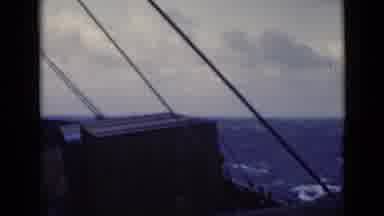 Persian Gulf (1947): A Boat With Some Cargo Boxes Sails The Blue Ocean Rocking