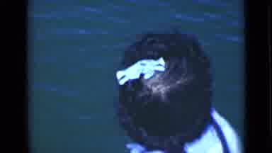 Suez Canal Egypt (1946): Woman Wearing White Hair Ribbon Looks At Water On A Clear