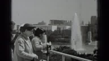 San Francisco California (1937): Woman Wearing Black Hat Looks At Water Fountain