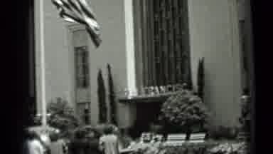 San Francisco California (1937): Well Dressed People Walk Toward Official Looking