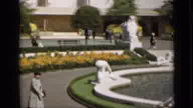 San Francisco California (1937): Lady Long Coat Hat Walking Toward Fountain White