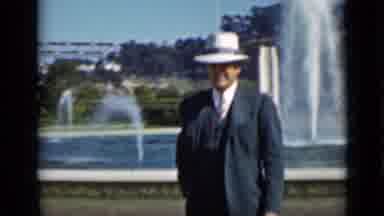 San Francisco California (1937): A Man In A Fedora And Suit Walks In Front Of A