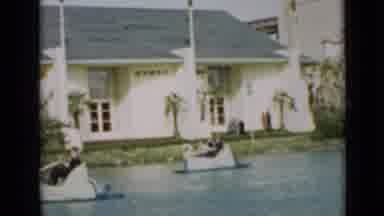 San Francisco California (1937): People Riding A Paddle Boat Near Yellow Flowers