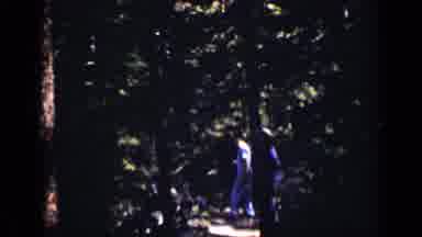 Colorado USA (1938): Two Small Children Explore In A Dense Forest Under A Clear
