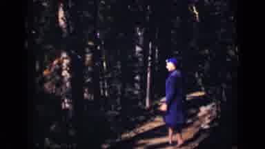 Colorado USA (1938): A Lady In Purple Attire Walks Slowly Down A Dark And Empty