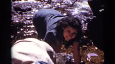 Colorado USA (1938): Woman Gets Ready For A Bath In A Stream Accompanied By
