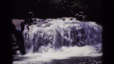 Colorado USA (1938): A River Flowing With Water With A Short Waterfall On The Path