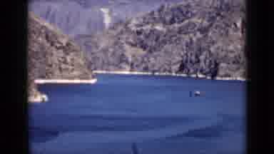 Arizona USA (1939): Vessel Sailing Through A Canal Past Rocky Cliffs On A Sunny