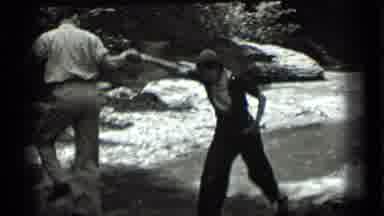 Clear Lake California (1939): Thean Helping The Boy Up The Rocks By The Water