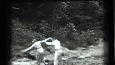 Clear Lake California (1939): A Man Helps Two Women Cross A Small Creek By Walking