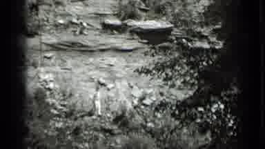 Clear Lake California (1939): 2 Men Climbing Down Very Steep Hill Both Wearing
