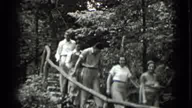 Clear Lake California (1939): Group Of People Walk Through A Forest Path