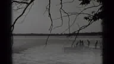 Clear Lake California (1939): Lakeside With A Small Pier That Has A Boat Tied To