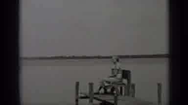 Clear Lake California (1939): Old Woman In Glasses Is Sitting On A Sea Shore At