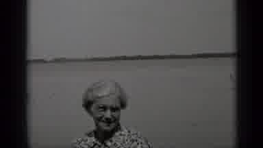 Clear Lake California (1939): An Elderly Women Standing At The Waterfront Midday
