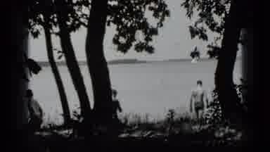 Clear Lake California (1939): Two Men Go Swimming In The Lake While The Other Man