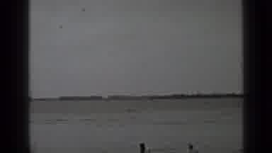 Clear Lake California (1939): Two People Swimming In A Lake Near A Jetty With A
