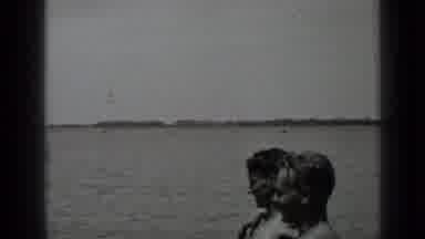 Clear Lake California (1939): Man And Woman Sitting By The Shore Of A Lake