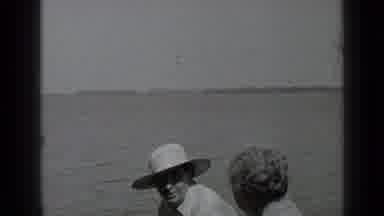 Clear Lake California (1939): Two People Chatting On Boat