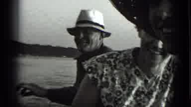 Clear Lake California (1939): Old Man With A Hat Smoking Near An Old Woman And