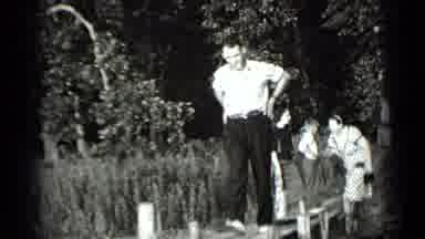 Clear Lake California (1939): A Man Who Is Smoking Walks Out The Wooden Plank Over