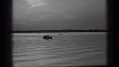 Clear Lake California (1939): A Woman On A Sailor Outfit Rowing On A Boat And Is