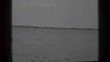Clear Lake California (1939): People Are Riding A Boat In Open Water On A Cloudy