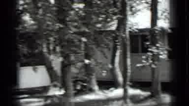 Clear Lake California (1939): A Lady Walking Through The Woods Around A White