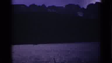 Colorado USA (1939): Shots Of The Sparkling Lake And The Tall Mountains At Dusk