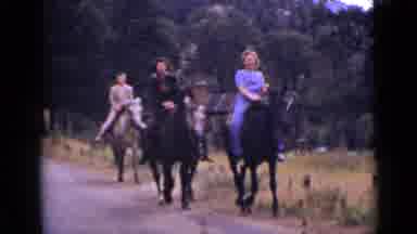 Colorado USA (1939): Three People Ride Horses Along The Road And Take In The