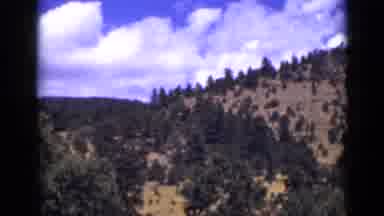 Colorado USA (1939): Scenes Of Mountains With Trees Growing On Them Bright Blue
