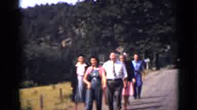 Colorado USA (1939): Group Of People Walking Down An Unpaved Road In Their Sunday