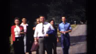 Colorado USA (1939): People Walking In A Square Full Of Flowers And Plants