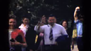 Colorado USA (1939): A Group Of People Walk Together And One Of Them Wave At The