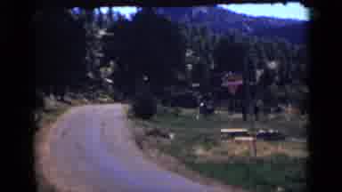 Colorado USA (1939): View Of Mountains Green Trees And Person Walking In Middle Of