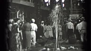 New York USA (1939): Many People Slowly Walking Through A Courtyard Observing The