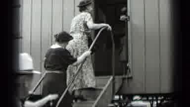 New York USA (1939): Woman Goes Into Rail Car With A Big Smile And Comes Out With